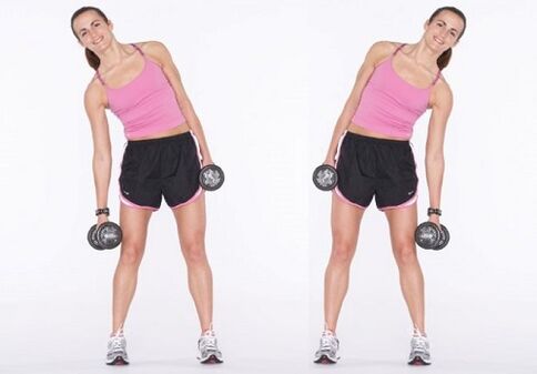 Flexiones laterales con mancuernas para fortalecer los músculos abdominales.
